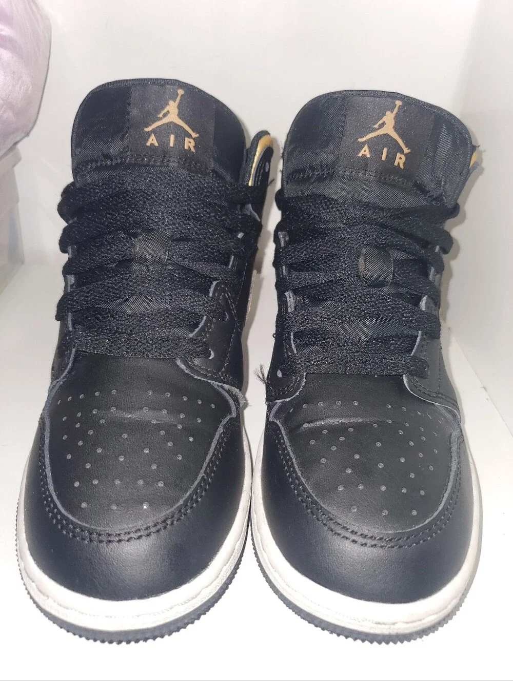 Nike Air Jordan 1 Mid Black/Gold Low-Top Sneakers